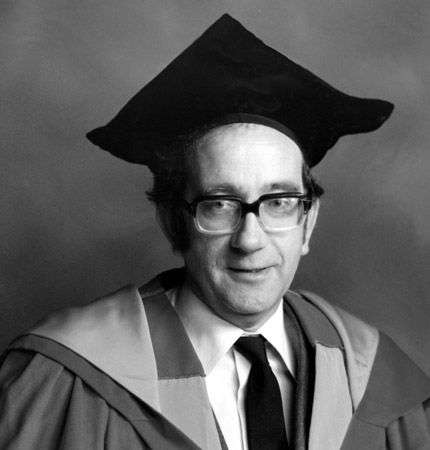 Black and white head and shoulder photo of the late SAMS biologist Alan Ansell in full academic robes